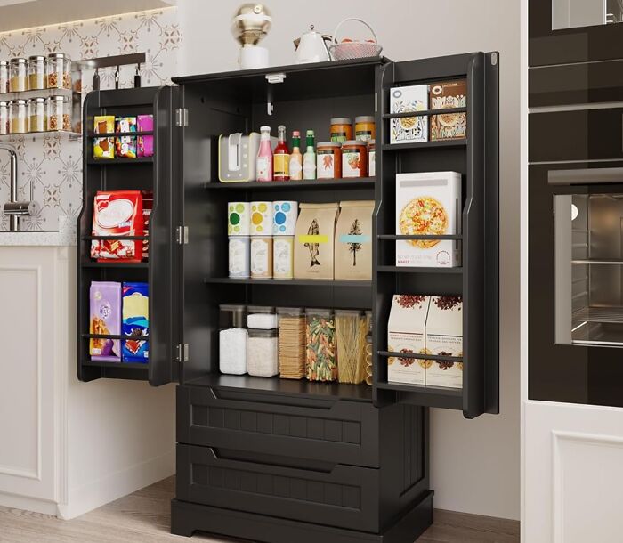 Sleek black kitchen pantry cabinet with organized food items and snacks, a must-have for your kitchen Prime Day wishlist.