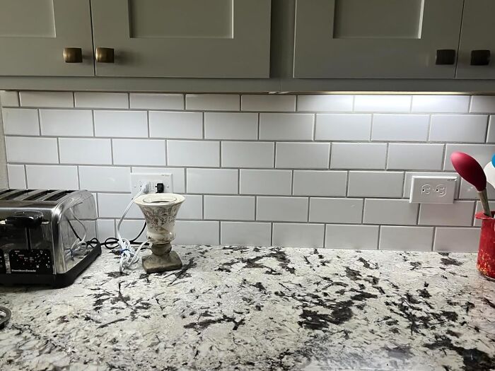 Modern kitchen countertop with white subway tile backsplash and essential small appliances for Prime Day finds.