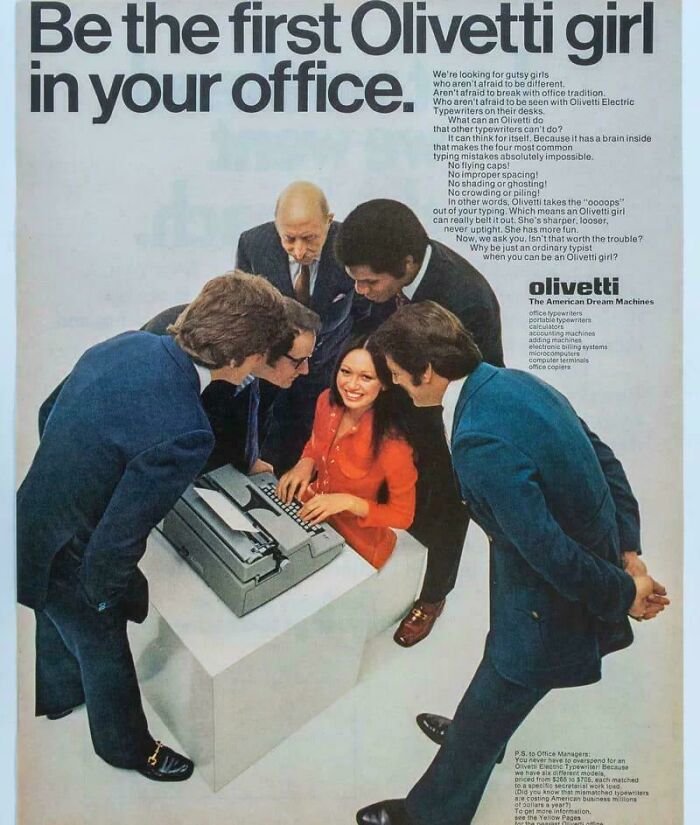 Vintage office photo showing a woman at a typewriter surrounded by men, illustrating ridiculous past workplace norms.