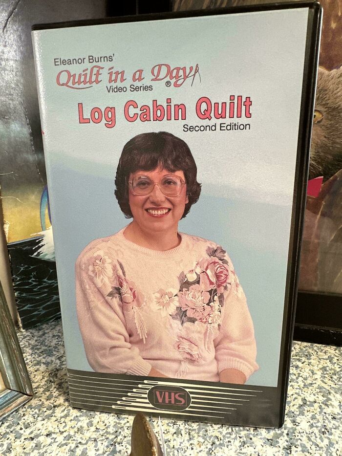 Vintage VHS cover of a Log Cabin Quilt tutorial from Eleanor Burns in a nostalgic setting from the past.