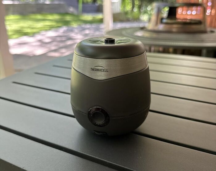 Thermacell mosquito repellent device on a gray outdoor table in natural light, popular on Amazon wishlist finds.