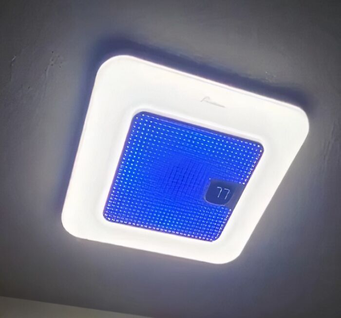 Smart ceiling light fixture with digital thermostat display showing 77 degrees among Prime Day home deals.