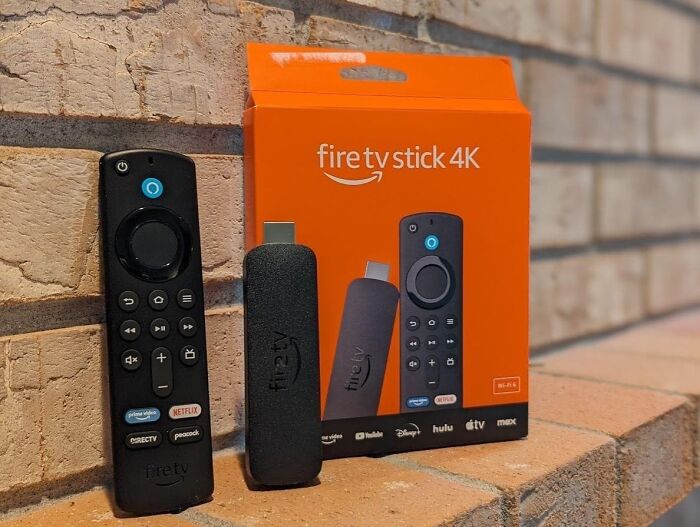 fire tv stick 4k streaming device and remote showcased as top Prime Day deals under $25 to save your bank account