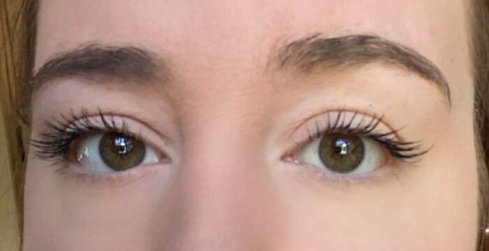 Close-up of green eyes with long lashes, emphasizing security and trust related to bank account safety and Prime Day deals.