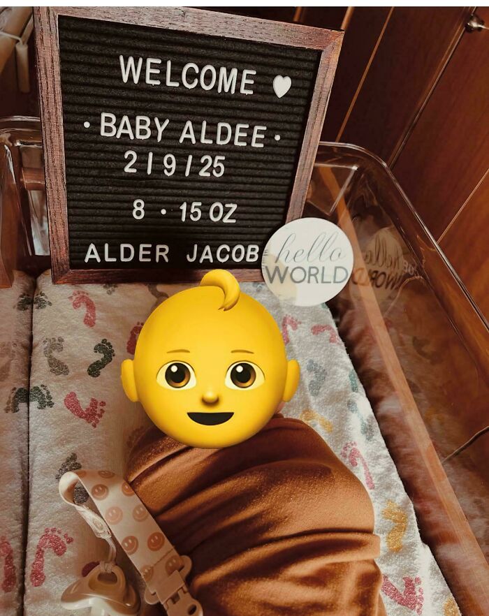 Newborn baby in hospital bassinet with a welcome sign highlighting unique baby names loved by parents but judged by others.