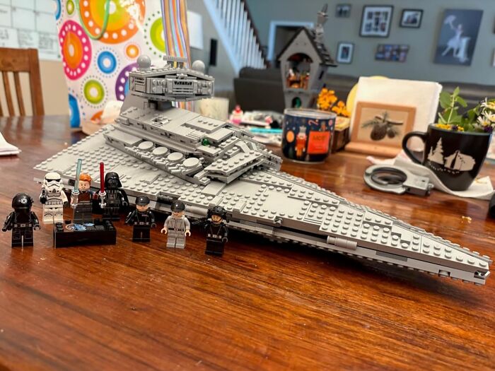 LEGO Star Wars spaceship and figures displayed on a wooden table showcasing prime day deals collectible items.