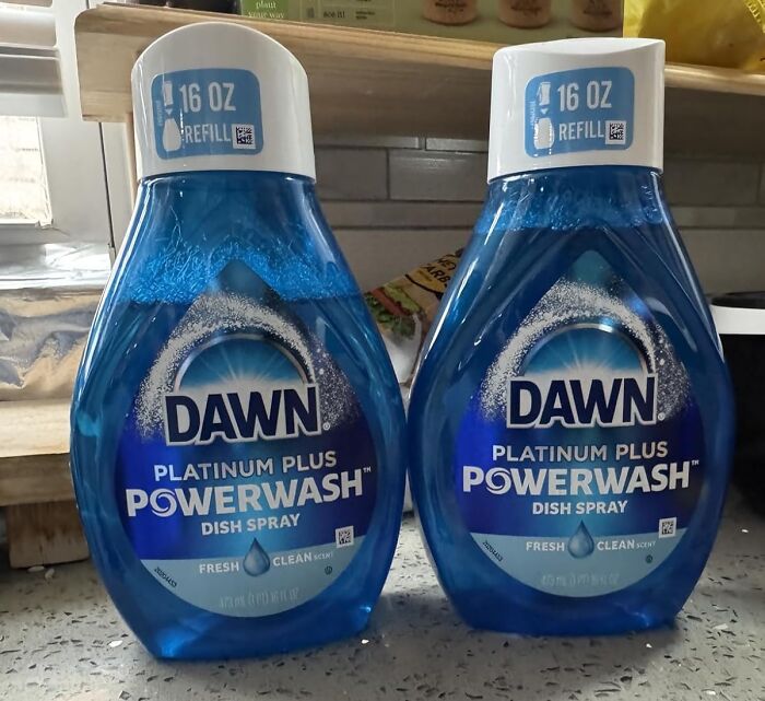 Two bottles of Dawn Platinum Plus Powerwash dish spray in a kitchen, featured in popular Prime Day deals.