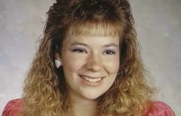 Young woman with curly hair smiling, representing one of the most interesting mysteries that still baffle people.