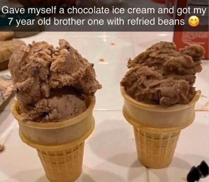 Two ice cream cones side by side, one with chocolate ice cream and the other with refried beans, funny memes concept.