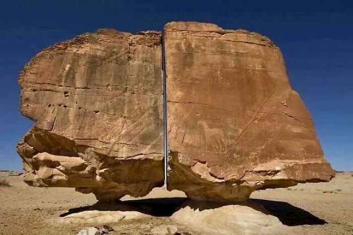 Split rock formation in a desert landscape representing one of the most interesting mysteries that still baffle people worldwide