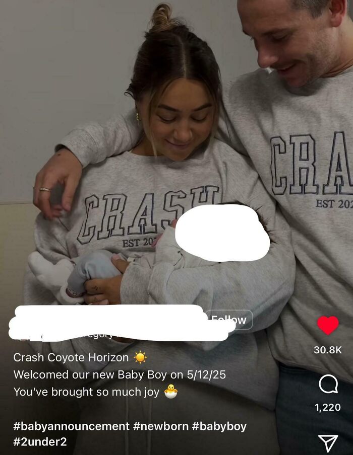 Couple wearing matching crash sweatshirts, holding their newborn baby, celebrating a unique baby name announcement.