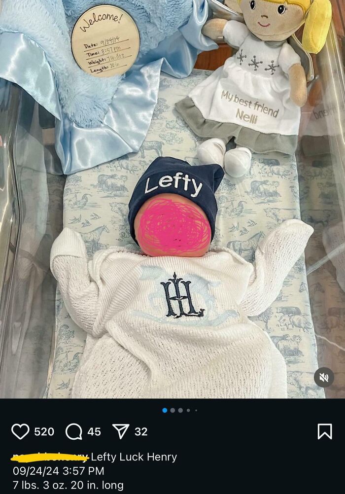 Newborn baby in a hospital bassinet wearing a hat with Lefty Luck Henry, one of the unique baby names parents loved.