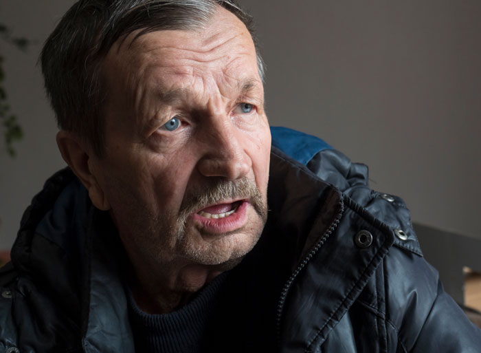 Older man reacting with surprise and concern, illustrating parents freaking out over bride replacing kids with pets at wedding.