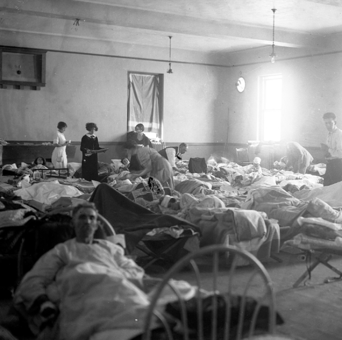 Hospital ward filled with injured patients and nurses providing care after the worst tornado in US history.