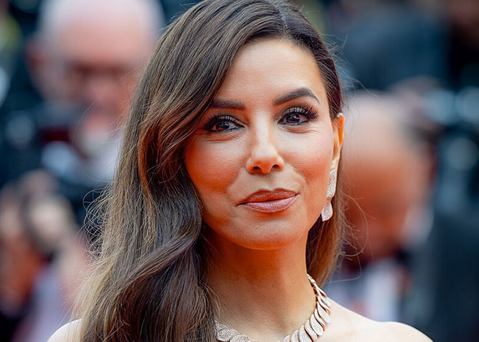 Close-up of a woman attending a red carpet event, representing celebrities before fame found them.