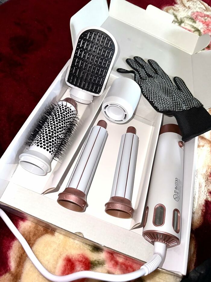 Multi-tasking hair styling tool kit with brush attachments and heat-resistant glove for versatile home use.