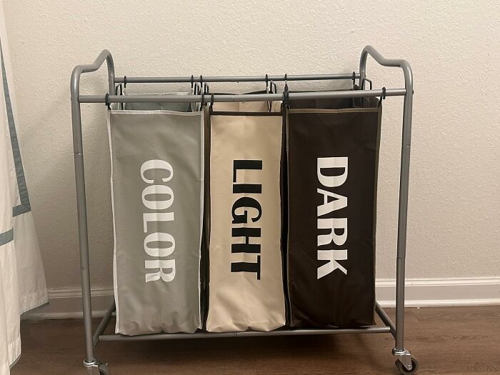 Laundry sorter with three labeled bags for color, light, and dark clothes, a practical Prime Day home deal item.