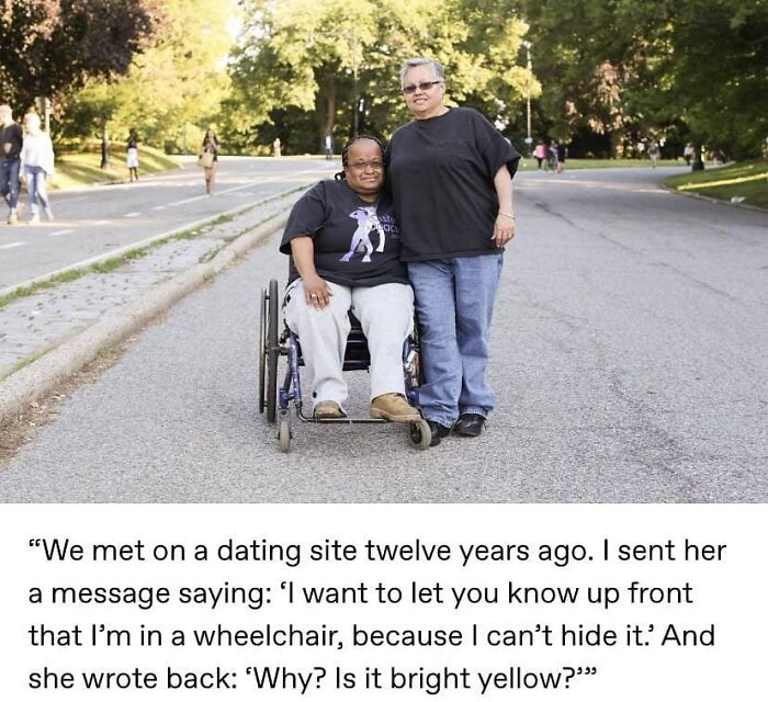 Two women smiling outdoors, one in a wheelchair, representing the wholesome side and feel-good moments of humanity.