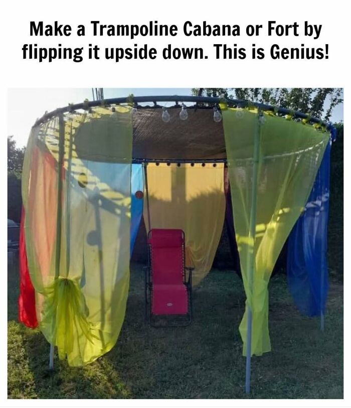 DIY craft project of a trampoline cabana made by flipping it upside down, surrounded by colorful fabric curtains.