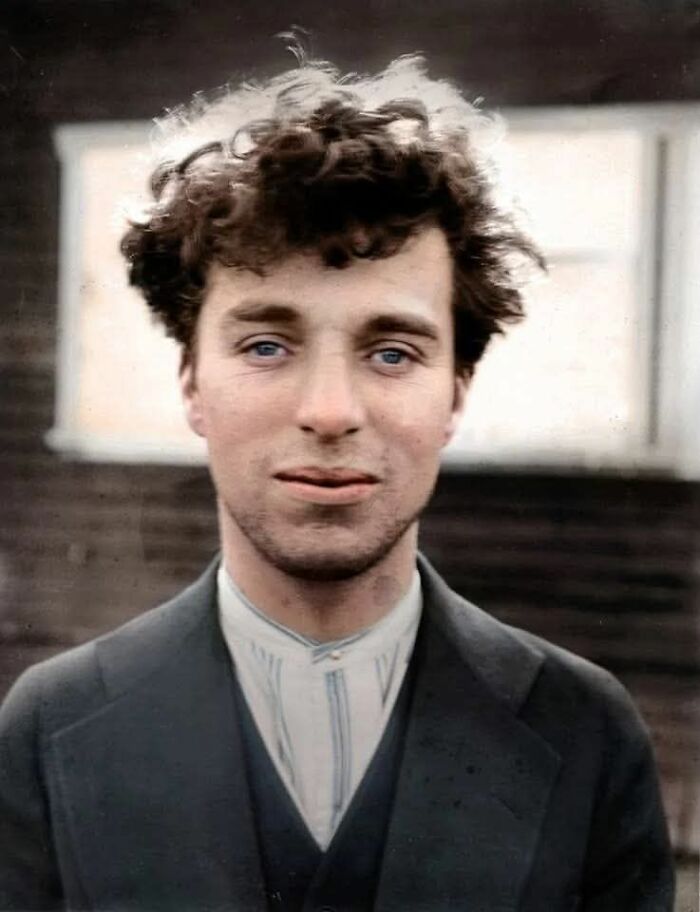 Young man with curly hair in vintage attire, a fascinating historical photo that offers a new perspective on the past.
