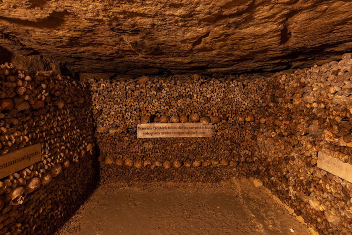 Underground chamber filled with human skulls and bones in one of the scariest places around the world to visit.