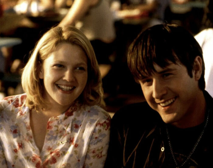Couple smiling in a scene from The Notebook, illustrating romantic movies that are considered toxic relationships.