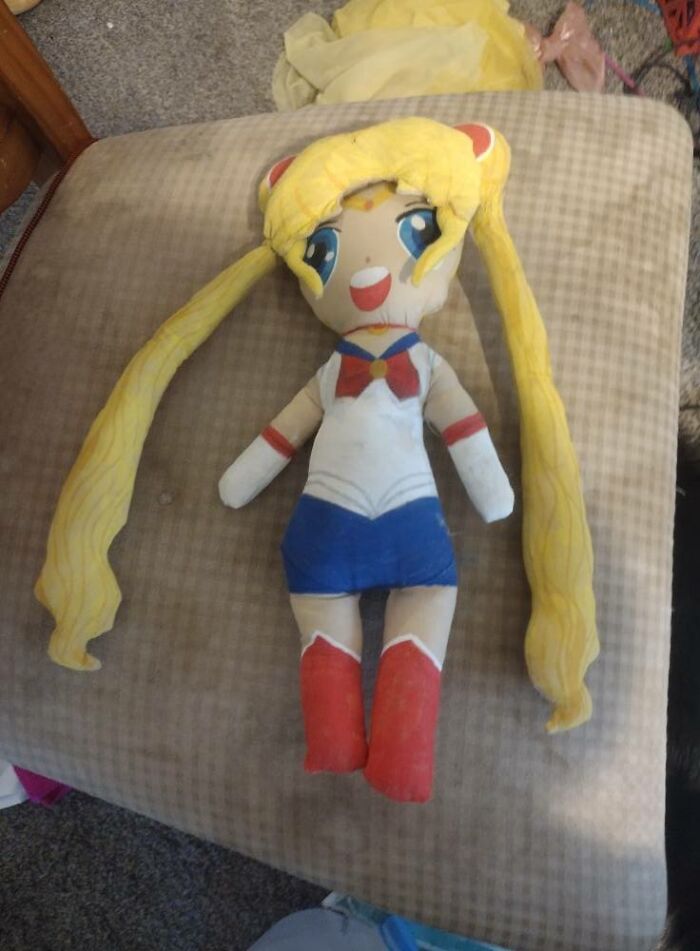 Handmade DIY doll with long yellow hair and colorful outfit, featured in craft shaming DIY project failures.