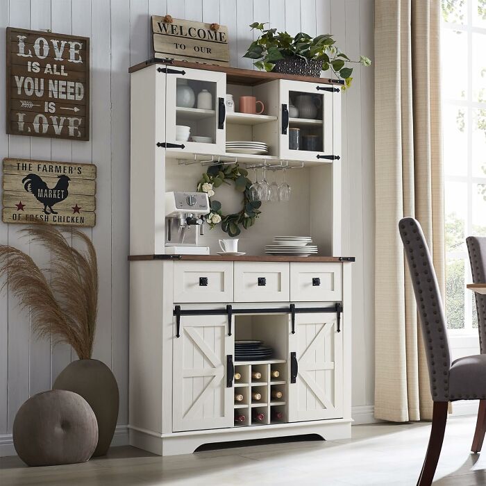 White farmhouse kitchen cabinet with wine storage, dishes, and coffee maker, showcasing prime day kitchen finds.
