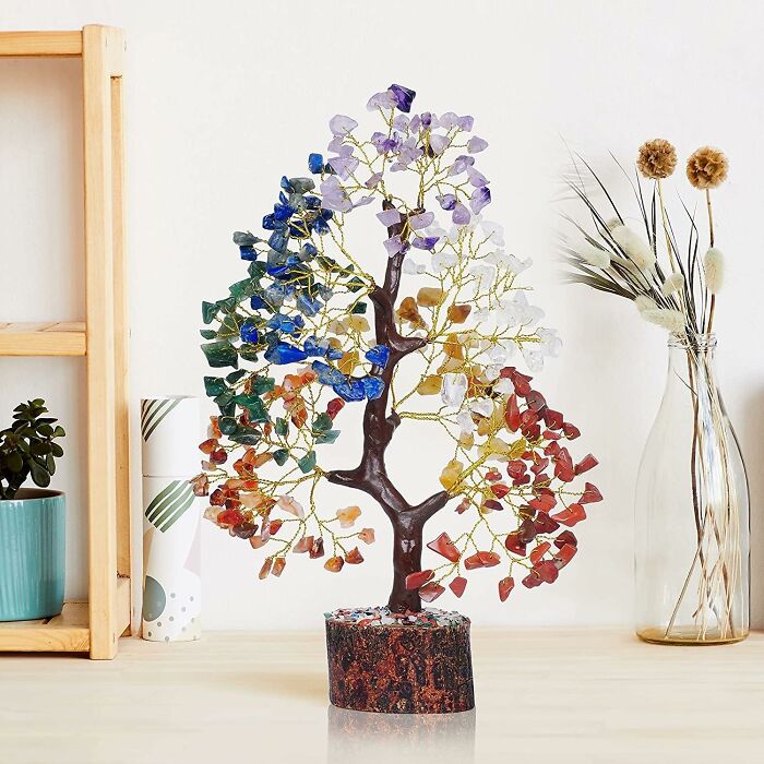 Decorative gemstone tree with colorful leaves on a wooden base, perfect arty find for creative spirit home decor.