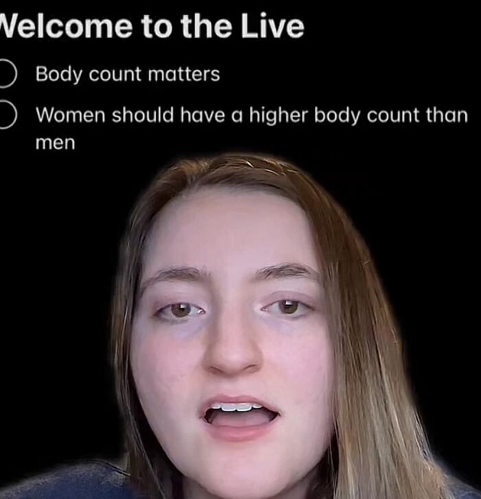 Young woman speaking in a video live stream discussing body count opinions in an exhausting relationship context.