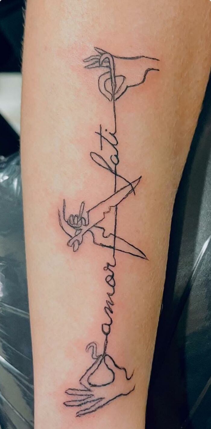 Minimalist tattoo with three hands and cursive word that appears misspelled, showcasing a hilariously bad tattoo design.