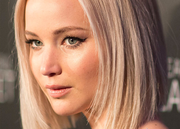 Close-up of a blonde celebrity with light makeup, highlighting what celebrities were doing before fame found them.