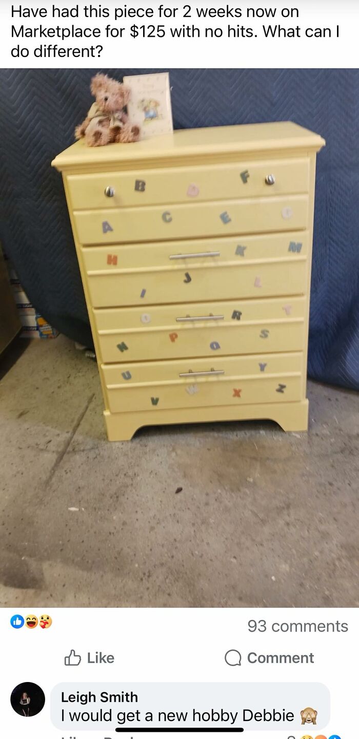 Yellow dresser with scattered colorful alphabet stickers, stuffed bear, and card on top, showcasing horrible crafts shamed by netizens.