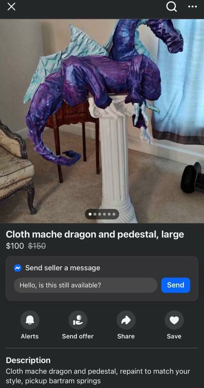 Cloth mache dragon DIY project displayed on white pedestal in a living room, showcasing craft shaming humor.