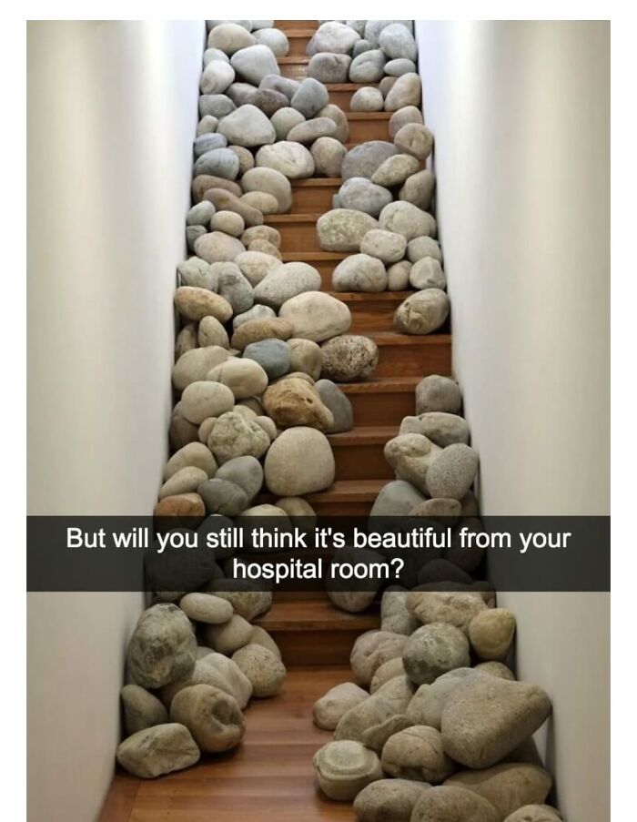Stairs covered with large uneven rocks on each step, creating a dangerous death stairs hazard inside a narrow hallway.