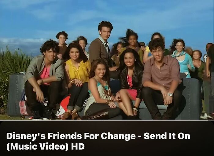 Group of diverse young adults sitting outdoors in casual attire, representing a community bridging Millennials and Gen Z.