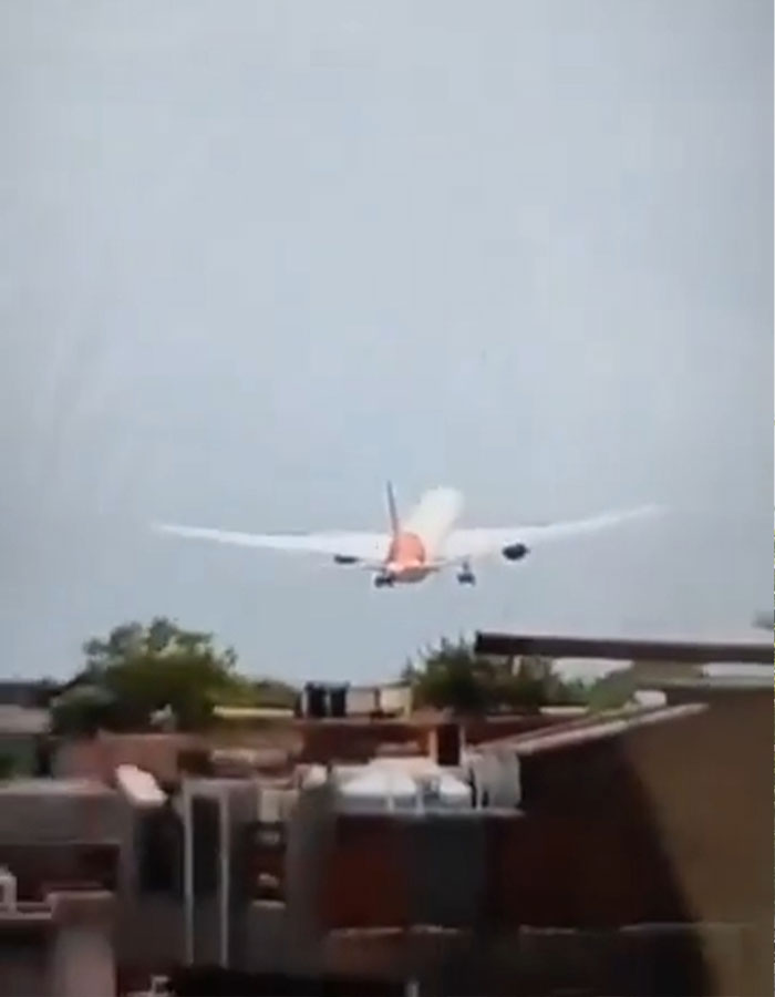 Plane approaching unusually low over buildings during take-off, prompting expert suggesting evil intent after crash.