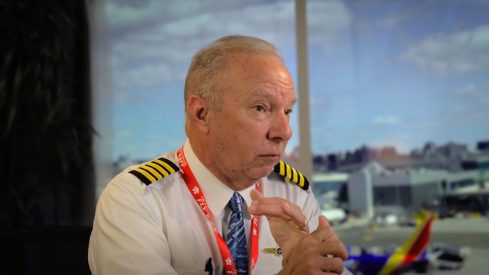 Experienced pilot discussing theory on simple mistake that may have caused tragic Air India crash in airport setting.
