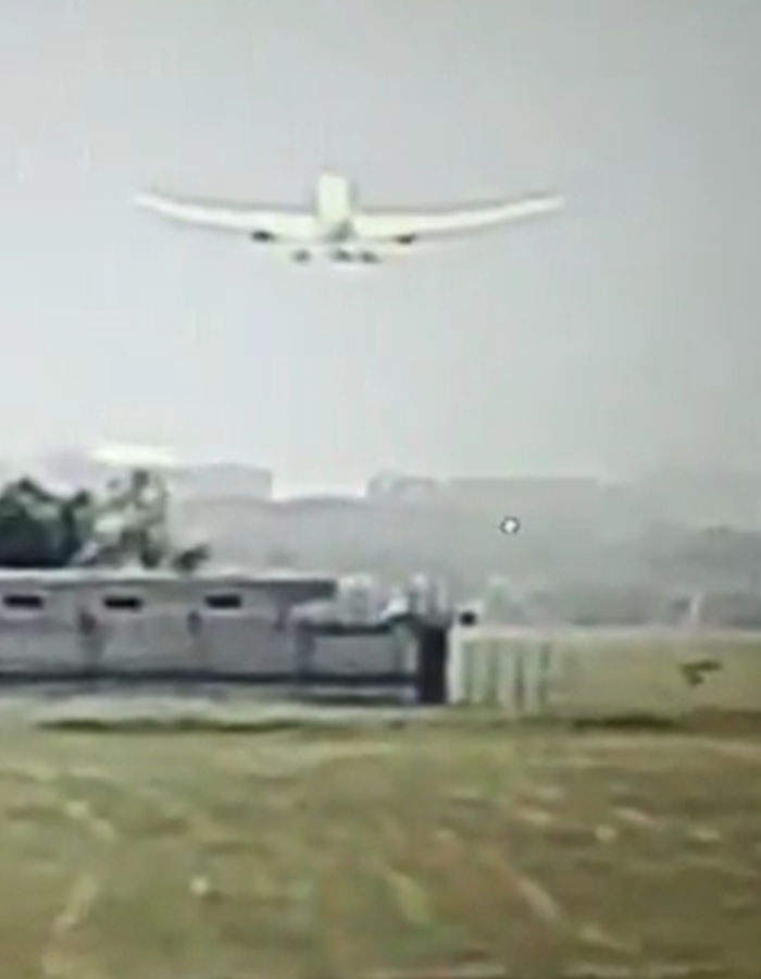 Small airplane flying low over an open field, linked to expert theory on simple mistake in Air India crash.