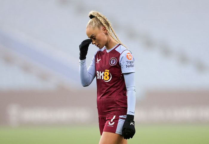 Female national soccer team player showing frustration during a match after defeat by U15 boys team. Female national soccer team player showing frustration during a match after defeat by U15 boys team.