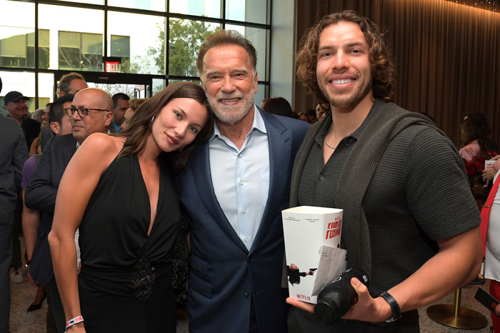 Arnold Schwarzenegger with fans at a public event highlighting his look-alike love child and family dynamics. Arnold Schwarzenegger with fans at a public event highlighting his look-alike love child and family dynamics.
