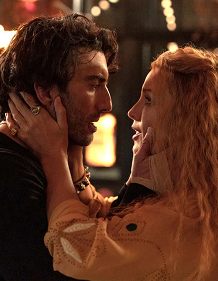 Blake Lively faces backlash over alleged rude behavior during a shopping trip, shown in an intimate moment with a man.