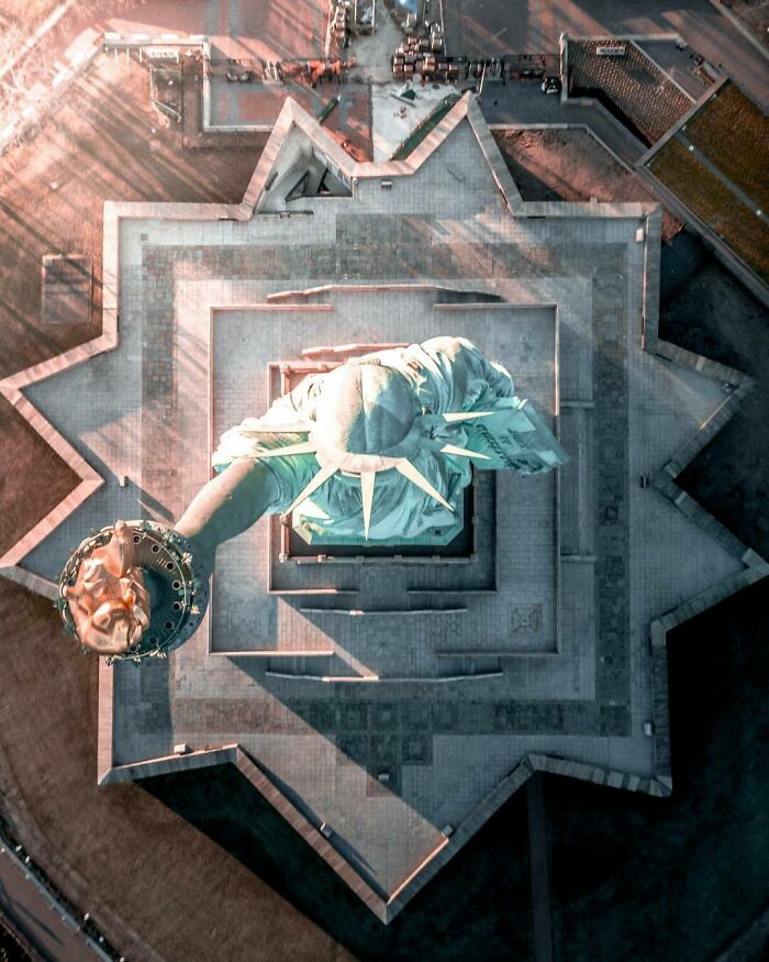 Aerial view of the Statue of Liberty, showcasing a famous landmark from an unexpected angle for a new perspective.
