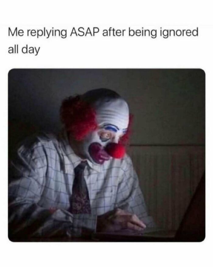 Person dressed as clown replying ASAP on laptop, capturing relatable energy of being ignored all day in a meme format.