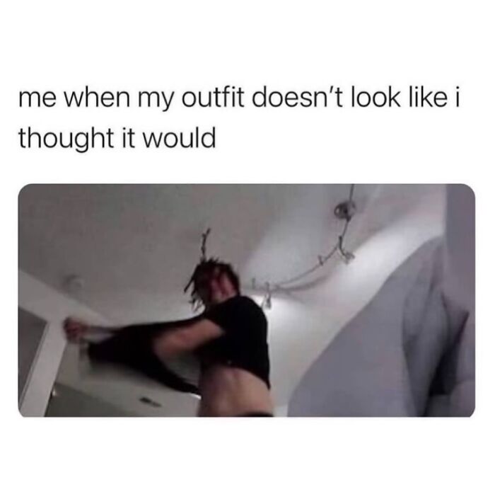 Person in a dark shirt taking it off indoors, expressing relatable energy about outfit not looking as expected.