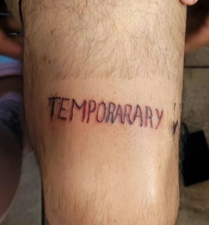 Tattoo on leg with word temporary misspelled, one of the bizarre choices people made while getting tattoos.