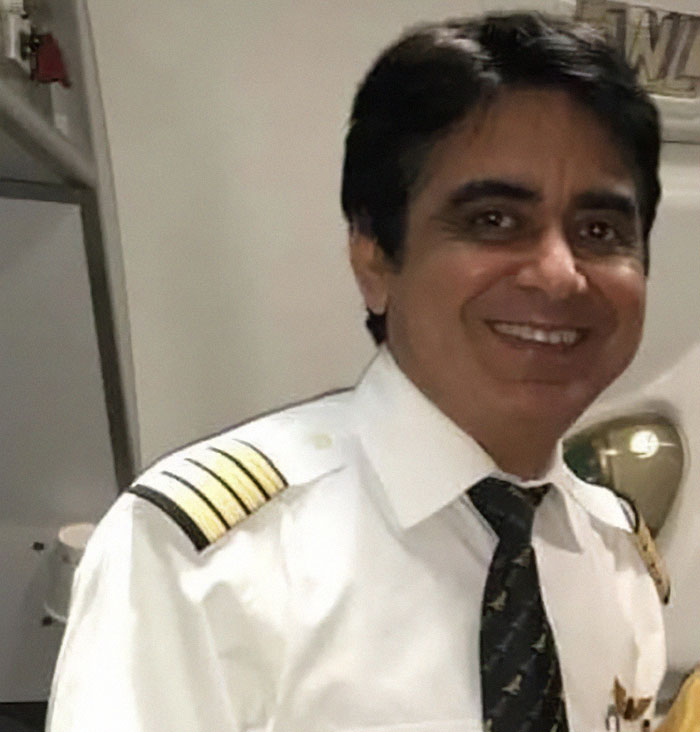 Male Air India pilot in uniform smiling, representing final words to control tower before plane crashed revealed.