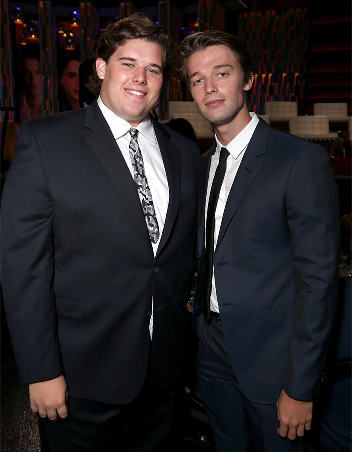 Christopher Schwarzenegger in a sharp suit, showcasing dramatic weight loss during a red carpet appearance with family. Christopher Schwarzenegger in a sharp suit, showcasing dramatic weight loss during a red carpet appearance with family.