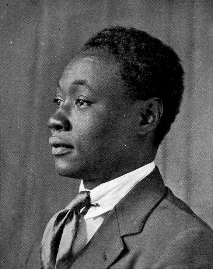 Portrait of a man in suit and tie symbolizing crucial moments that defined the Harlem Renaissance era in Black history.