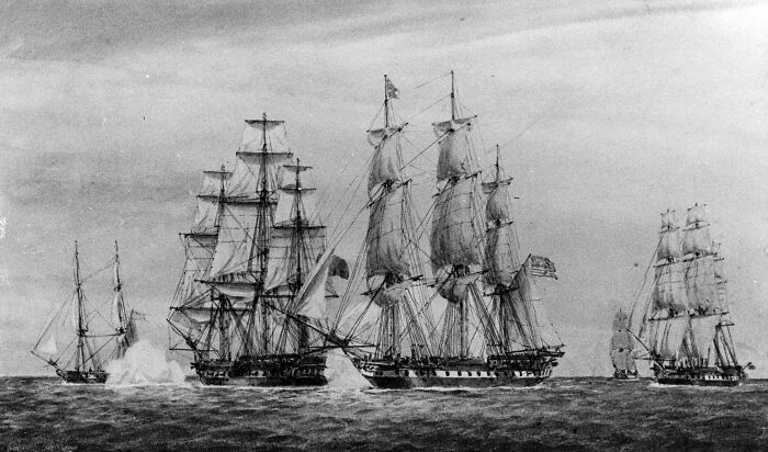 Vintage illustration of tall sailing ships on the ocean, representing Grace O’Malley commanding ships in battle.